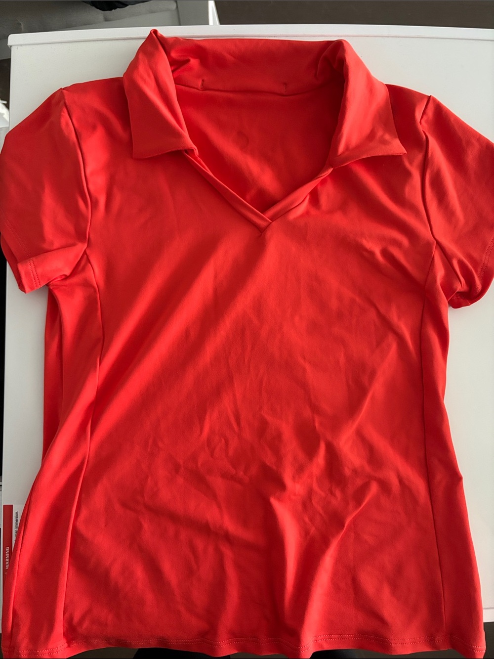 Women’s Short-Sleeve V-Neck Polo Top in Red
